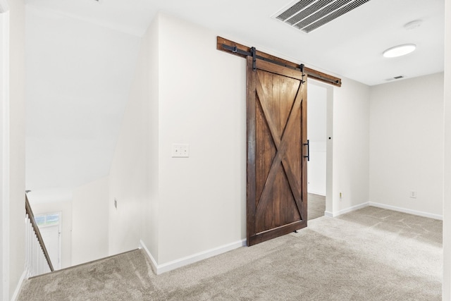 2003 Solomon Ct, Spring Hill, TN 37174 - unfurnished room with a barn door, carpet, and a smoke detector