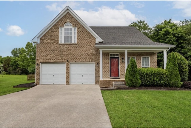 2003 Solomon Ct, Spring Hill, TN 37174 - view of front of home with a front yard, an attached garage, driveway, brick siding, and roof with shingles