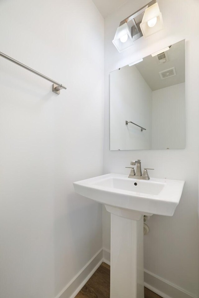 4316 Summercrest Blvd Unit 713, Antioch, TN 37013 - bathroom featuring baseboards and wood finished floors