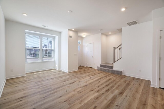 4316 Summercrest Blvd Unit 713, Antioch, TN 37013 - unfurnished living room with light wood-style flooring, stairs, and recessed lighting