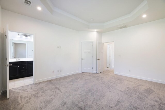 4316 Summercrest Blvd Unit 713, Antioch, TN 37013 - unfurnished bedroom featuring a raised ceiling, light carpet, recessed lighting, and ensuite bathroom