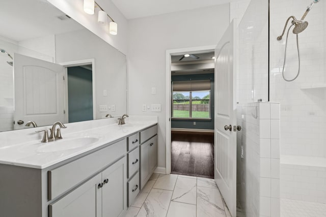 321 Twelve Oaks Ln, Lebanon, TN 37087 - bathroom with double vanity, tiled shower, and marble look tiles