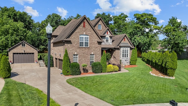 429 Acacia Grove Ln, Lebanon, TN 37087 - view of front facade featuring a front yard, an outbuilding, and a detached garage