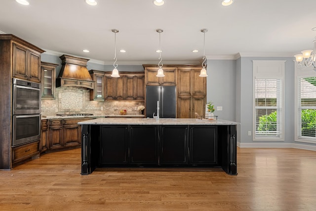 429 Acacia Grove Ln, Lebanon, TN 37087 - kitchen with custom range hood, stainless steel appliances, light wood finished floors, backsplash, and crown molding