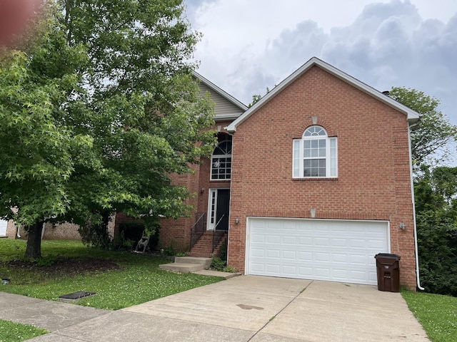 1561 Constitution Ave, Nashville, TN 37207 - view of front of house featuring driveway, an attached garage, brick siding, and a front yard