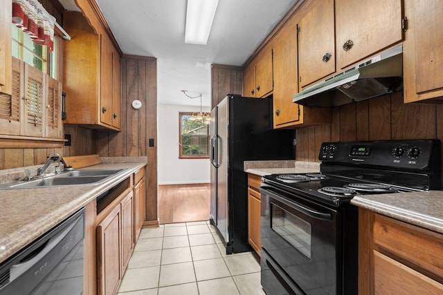 2706 Walnut Ln, Murfreesboro, TN 37129 - kitchen featuring black appliances, under cabinet range hood, brown cabinets, and light countertops