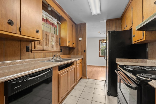 2706 Walnut Ln, Murfreesboro, TN 37129 - kitchen featuring black appliances, under cabinet range hood, light countertops, light tile patterned floors, and brown cabinetry