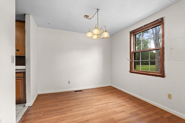 2706 Walnut Ln, Murfreesboro, TN 37129 - unfurnished room featuring light wood-style floors and a chandelier