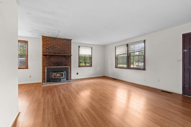 2706 Walnut Ln, Murfreesboro, TN 37129 - unfurnished living room featuring wood finished floors and a fireplace