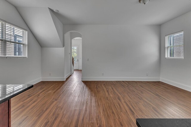 240 Sounder Cir, La Vergne, TN 37086 - unfurnished room with arched walkways, wood finished floors, and lofted ceiling