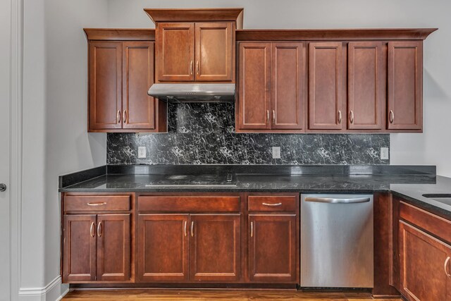 240 Sounder Cir, La Vergne, TN 37086 - kitchen featuring stainless steel dishwasher, black electric stovetop, tasteful backsplash, under cabinet range hood, and dark stone counters