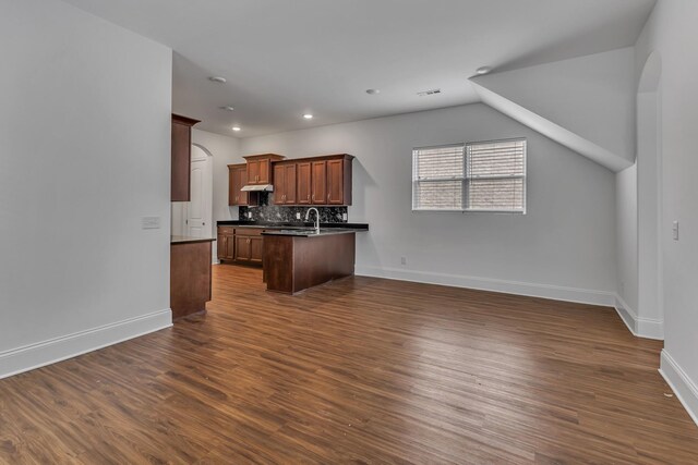 240 Sounder Cir, La Vergne, TN 37086 - kitchen featuring dark countertops, dark wood finished floors, backsplash, open floor plan, and recessed lighting