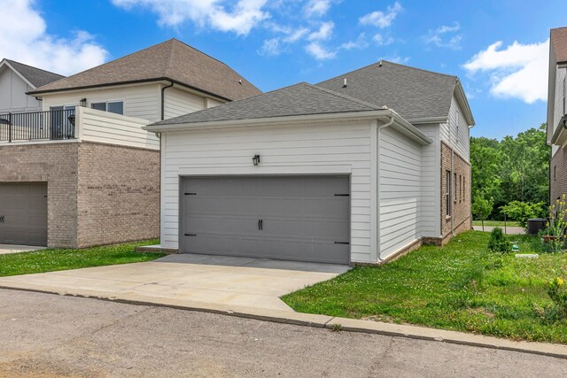 240 Sounder Cir, La Vergne, TN 37086 - view of property exterior featuring driveway, a shingled roof, a garage, and brick siding
