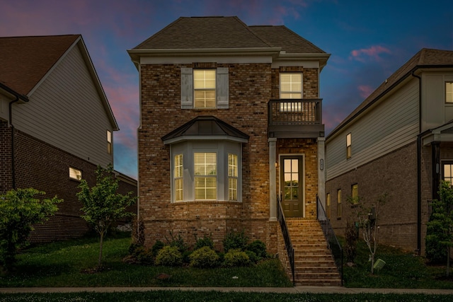 240 Sounder Cir, La Vergne, TN 37086 - traditional-style home with a balcony, brick siding, and a lawn