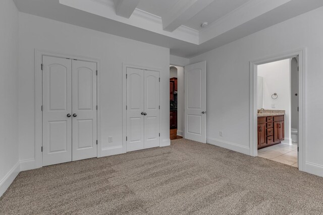 240 Sounder Cir, La Vergne, TN 37086 - unfurnished bedroom with multiple closets, light carpet, ensuite bath, ornamental molding, and beam ceiling