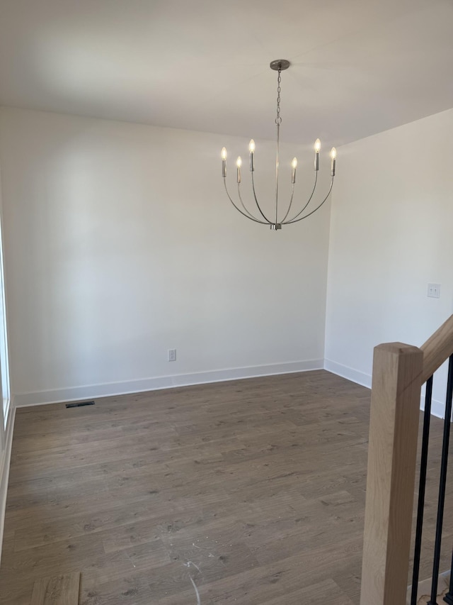 321 Wesson Dr, Clarksville, TN 37043 - spare room featuring a chandelier and dark wood-style floors