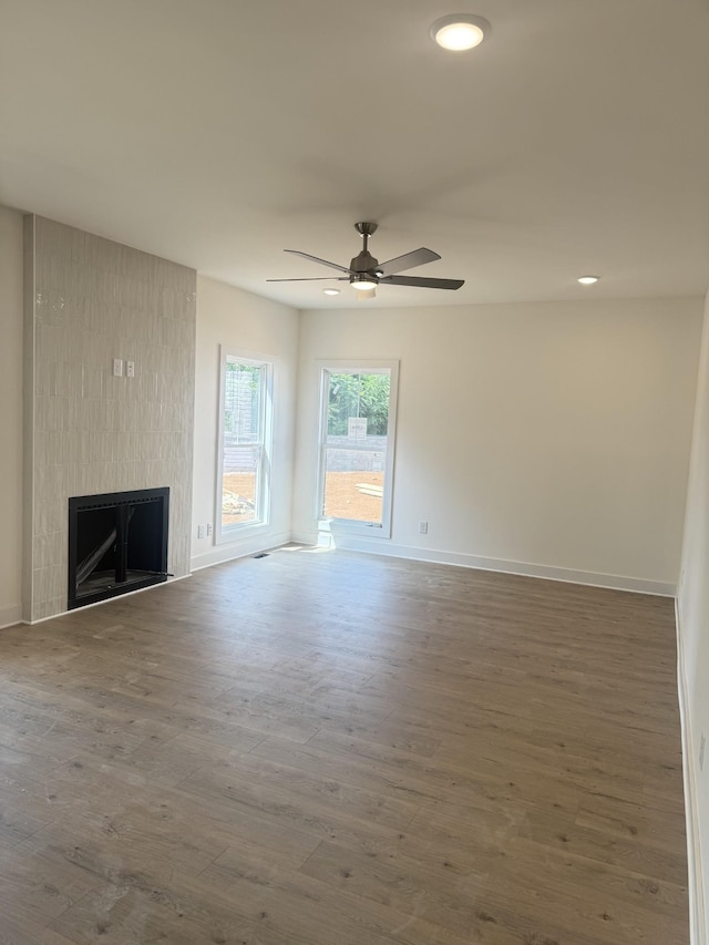 321 Wesson Dr, Clarksville, TN 37043 - unfurnished living room featuring a large fireplace, ceiling fan, wood finished floors, and recessed lighting