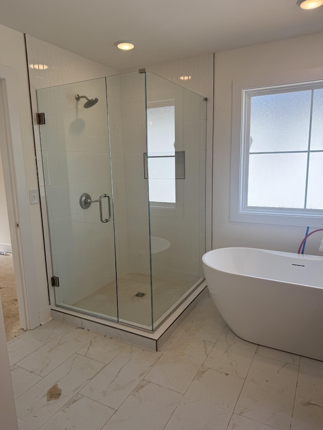 321 Wesson Dr, Clarksville, TN 37043 - bathroom with marble look tiles, a shower stall, a soaking tub, and recessed lighting