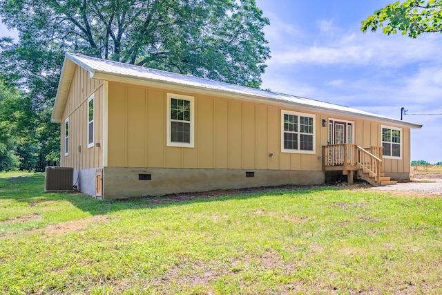 255 Second Creek Rd, Five Points, TN 38457 - view of front of property with crawl space, board and batten siding, a front yard, and a metal roof