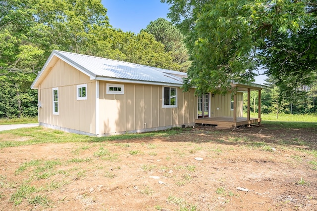 255 Second Creek Rd, Five Points, TN 38457 - view of side of home featuring board and batten siding and a metal roof