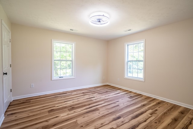 255 Second Creek Rd, Five Points, TN 38457 - empty room with wood finished floors and plenty of natural light