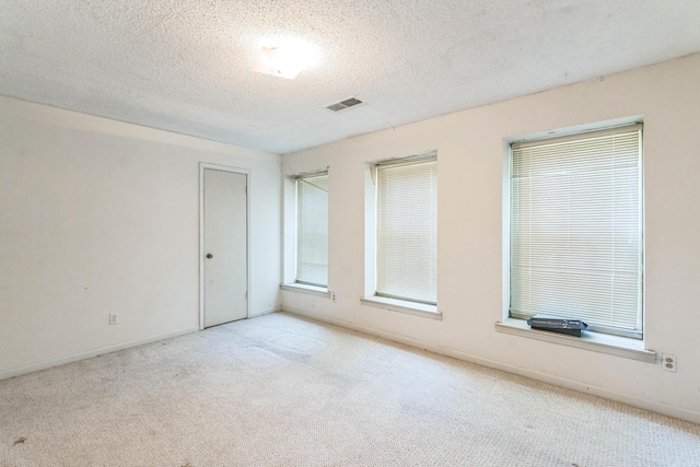5430 Gatehouse Dr Unit 5430, Memphis, TN 38134 - empty room featuring carpet floors, a textured ceiling, and plenty of natural light