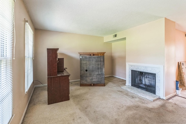 5430 Gatehouse Dr Unit 5430, Memphis, TN 38134 - unfurnished living room with a fireplace, carpet flooring, and a textured ceiling