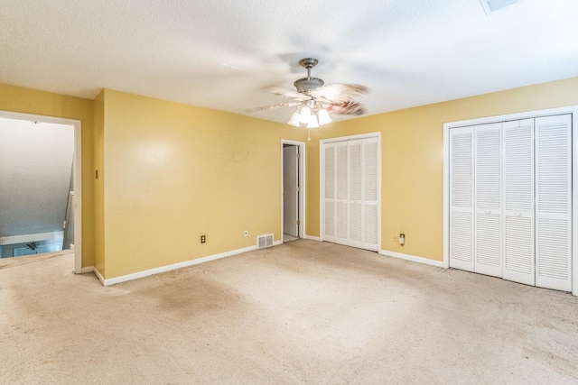 5430 Gatehouse Dr Unit 5430, Memphis, TN 38134 - unfurnished bedroom with carpet, multiple closets, and ceiling fan