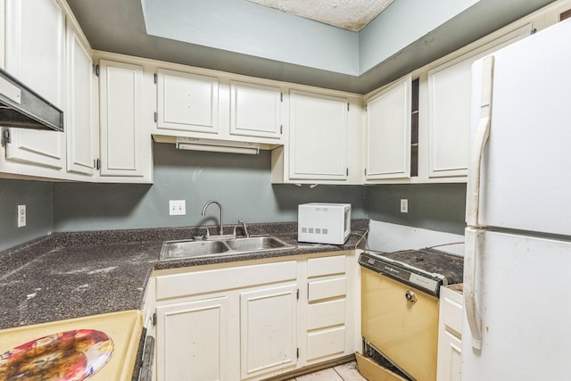 5430 Gatehouse Dr Unit 5430, Memphis, TN 38134 - kitchen with white appliances, wall chimney exhaust hood, dark countertops, and white cabinetry