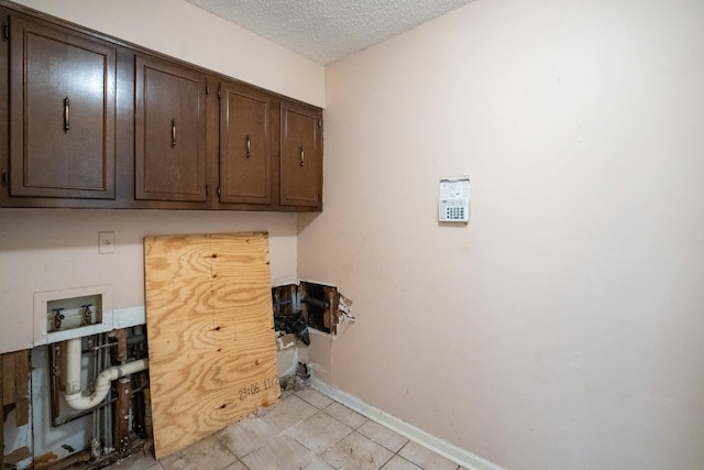 5430 Gatehouse Dr Unit 5430, Memphis, TN 38134 - laundry room with cabinet space, hookup for a washing machine, and a textured ceiling