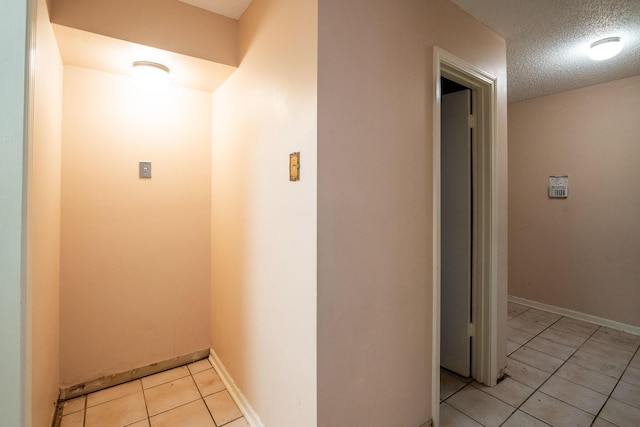 5430 Gatehouse Dr Unit 5430, Memphis, TN 38134 - corridor with a textured ceiling and light tile patterned flooring