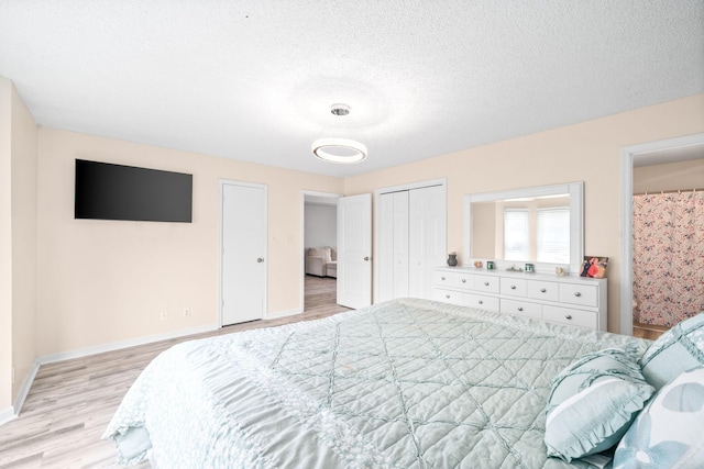 919 Desota Ln, Oak Grove, KY 42262 - bedroom featuring light wood-style floors and a textured ceiling