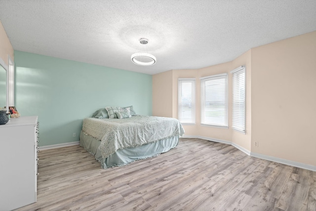 919 Desota Ln, Oak Grove, KY 42262 - bedroom with wood finished floors and a textured ceiling
