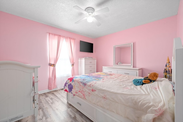 919 Desota Ln, Oak Grove, KY 42262 - bedroom featuring a textured ceiling, light wood finished floors, and ceiling fan