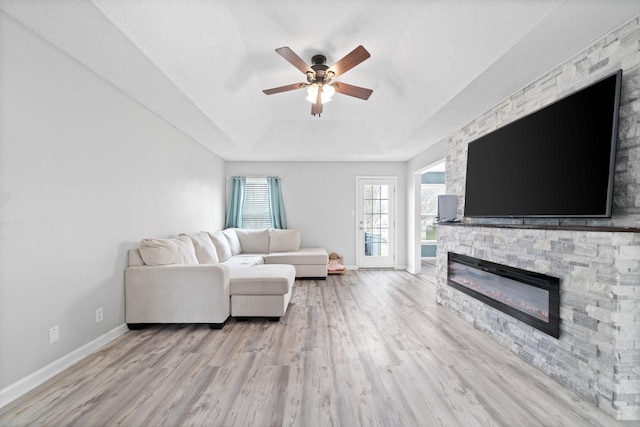 919 Desota Ln, Oak Grove, KY 42262 - living area featuring a fireplace, light wood finished floors, a ceiling fan, and a raised ceiling