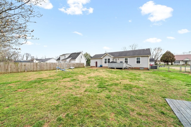 919 Desota Ln, Oak Grove, KY 42262 - back of house with a wooden deck, a fenced backyard, crawl space, and a playground
