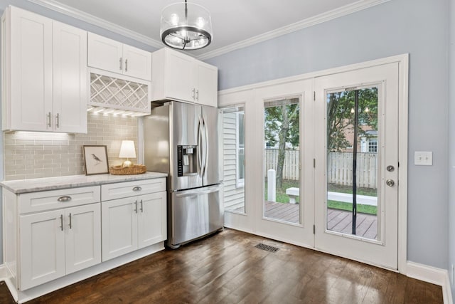 721 Shadowlawn Ct, Franklin, TN 37069 - kitchen featuring stainless steel refrigerator with ice dispenser, tasteful backsplash, crown molding, white cabinetry, and light stone countertops