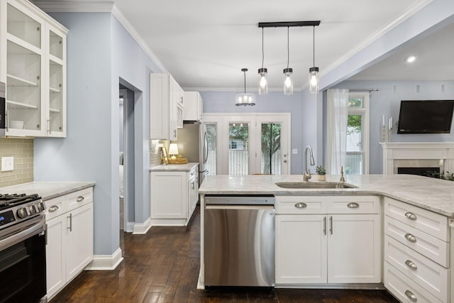 721 Shadowlawn Ct, Franklin, TN 37069 - kitchen with appliances with stainless steel finishes, tasteful backsplash, white cabinets, and ornamental molding