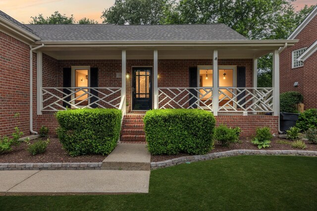 721 Shadowlawn Ct, Franklin, TN 37069 - view of front facade with brick siding, a porch, and a shingled roof