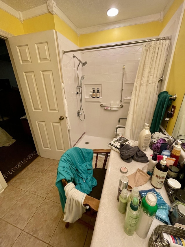 412 Howard Cir, Chattanooga, TN 37411 - bathroom with ornamental molding, tile patterned floors, and a tile shower