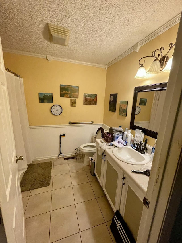 412 Howard Cir, Chattanooga, TN 37411 - bathroom with vanity, tile patterned flooring, ornamental molding, and a textured ceiling