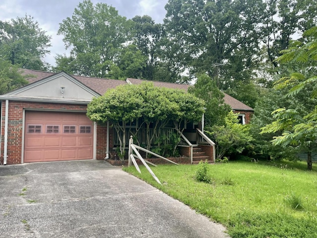 412 Howard Cir, Chattanooga, TN 37411 - obstructed view of property featuring concrete driveway, an attached garage, brick siding, a front yard, and roof with shingles