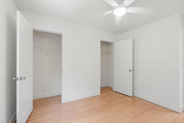 1108 Somerset Springs Dr, Spring Hill, TN 37174 - unfurnished bedroom with multiple closets, light wood-type flooring, and ceiling fan