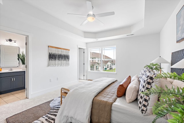 1108 Somerset Springs Dr, Spring Hill, TN 37174 - bedroom featuring ensuite bathroom, light colored carpet, a raised ceiling, a ceiling fan, and light tile patterned floors