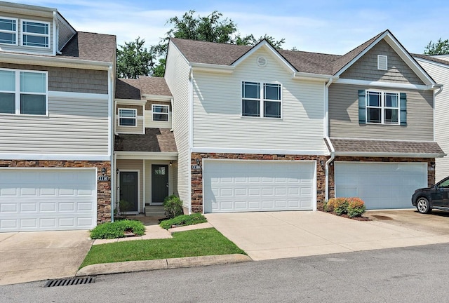 1108 Somerset Springs Dr, Spring Hill, TN 37174 - multi unit property with stone siding, concrete driveway, an attached garage, and a shingled roof