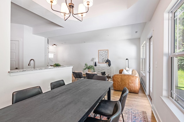 1108 Somerset Springs Dr, Spring Hill, TN 37174 - dining room featuring light wood-style flooring and a chandelier