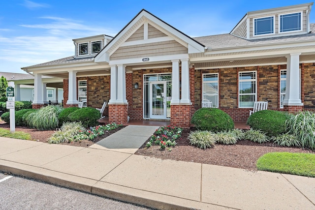 1108 Somerset Springs Dr, Spring Hill, TN 37174 - craftsman house with a porch, brick siding, and roof with shingles
