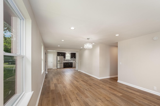 517 Danley Ct, Antioch, TN 37013 - unfurnished living room with recessed lighting, a chandelier, and wood finished floors
