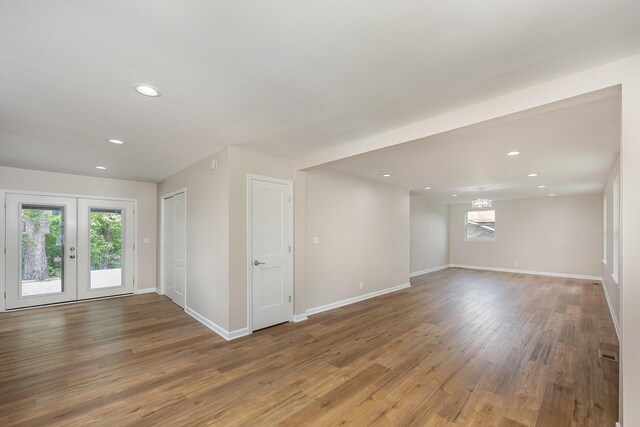 517 Danley Ct, Antioch, TN 37013 - spare room featuring wood finished floors, recessed lighting, french doors, and a chandelier