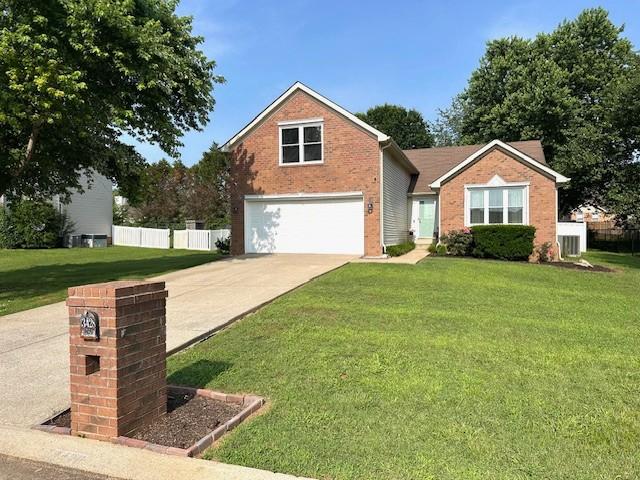 3428 Ravenel Ct, Murfreesboro, TN 37130 - view of front of property with a garage, brick siding, and driveway